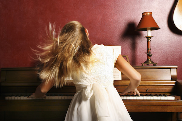 girl playing piano