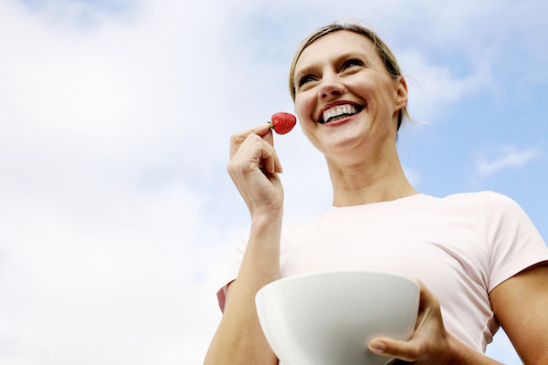 Woman Eating Healthy Fruit