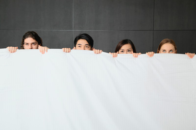 4 People Hiding Behind a Sheet