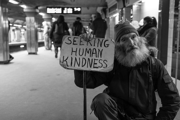 Homeless man with sign