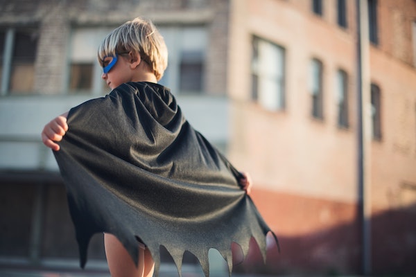 Little Boy Wearing Superhero Cape