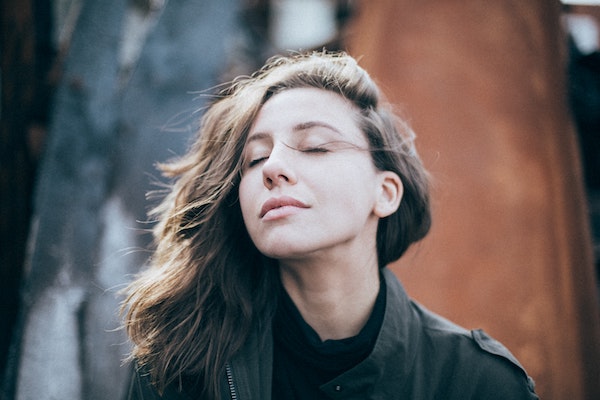 Woman in Deep Thought with Her Eyes Closed