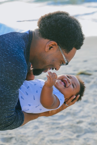 Man Holding Happy Baby