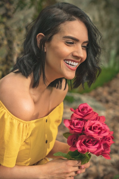 Woman Holding Bouquet of Flowers