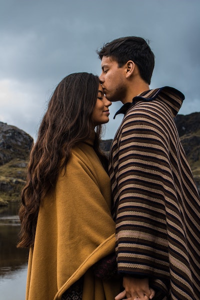 Man Kissing Partner on Forehead