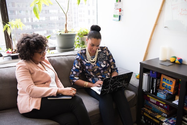 Two Professional Women Looking at Computer