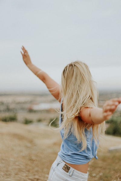 Woman Stretching Arms in Happiness