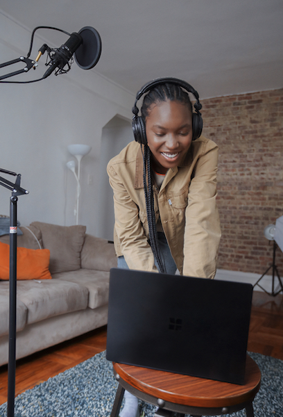 Woman Preparing to Sing with Headphones