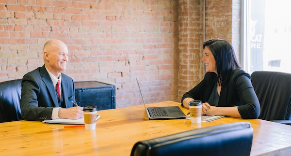 Two People Talking in Work Environment