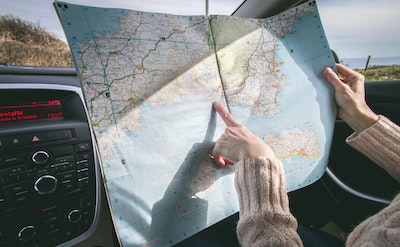 Woman Looking At Road Map