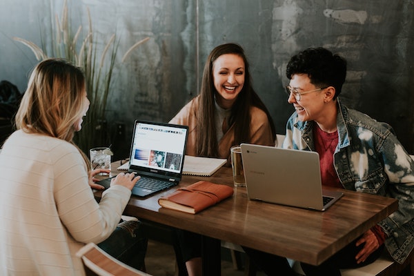 Colleagues Laughing Together in Work Environment