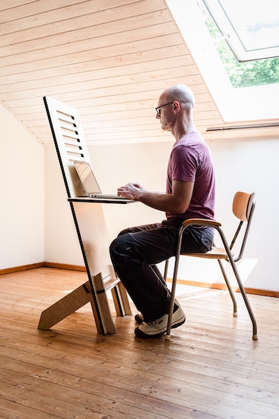 Man Sitting Up with Good Posture at Desk