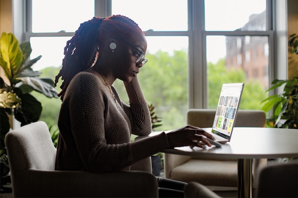 Woman Looking Focused at Her Computer