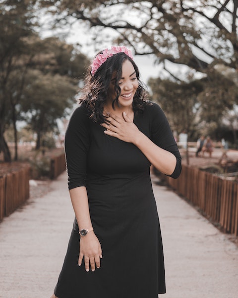 Happy, Smiling Woman with Hand on Heart