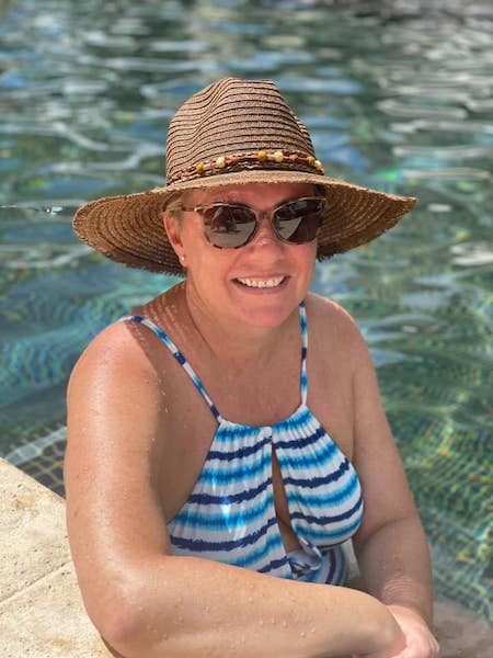 Natalie Wearing a Hat by the Pool