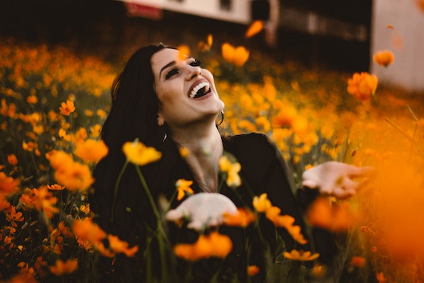 Smiling Woman in Flower Field