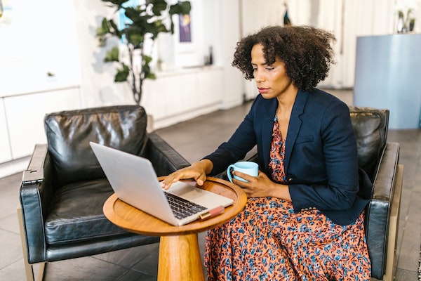 Woman Looking at Laptop