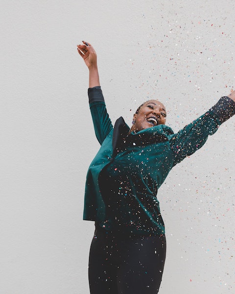 Happy Woman Dancing in Confetti