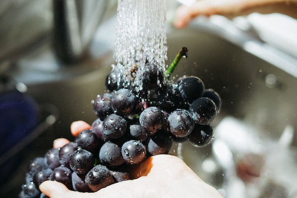 Rinsing Grapes Under Water