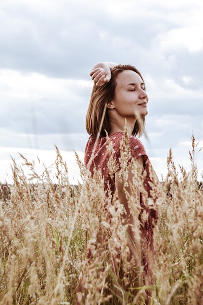 Woman Smiling, Standing in Field