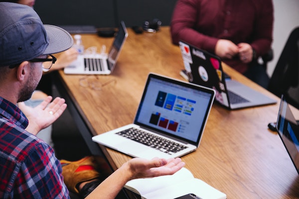 People In Meeting With Laptops