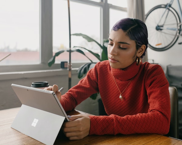 Person Looking at Computer Tablet