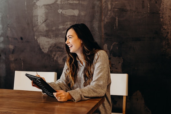 Woman Smiling at Desk