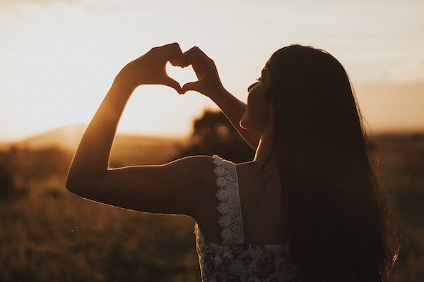 Woman Making Heart Shape With Hands